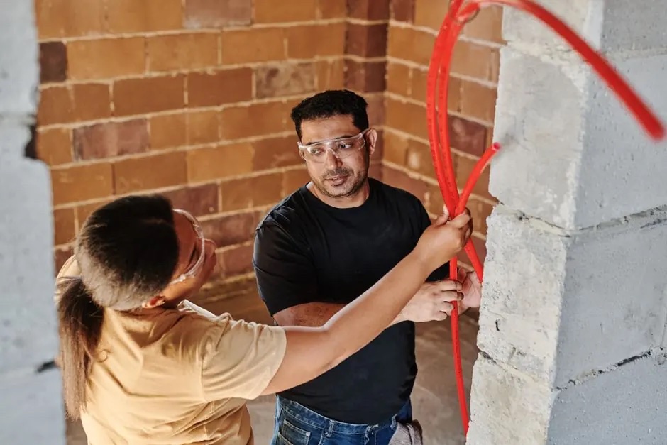 Plumbing crew installing new residential water lines